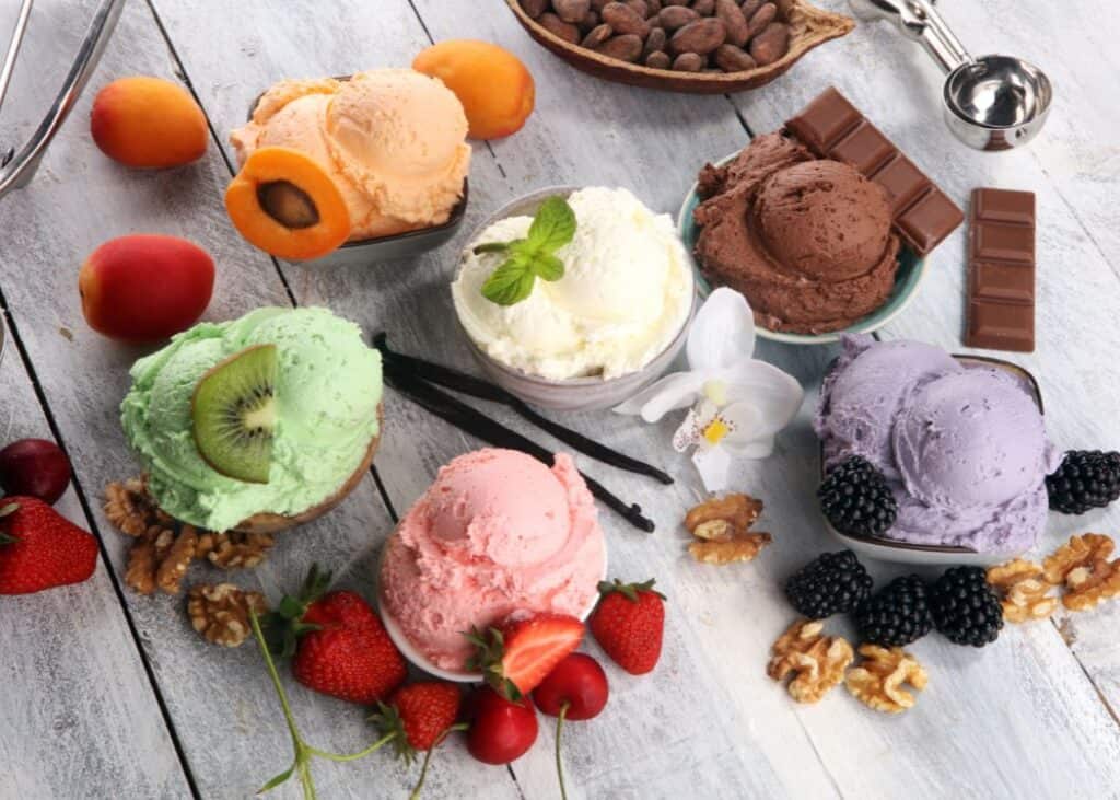 Pastel coloured scoops of ice cream with other ingredients