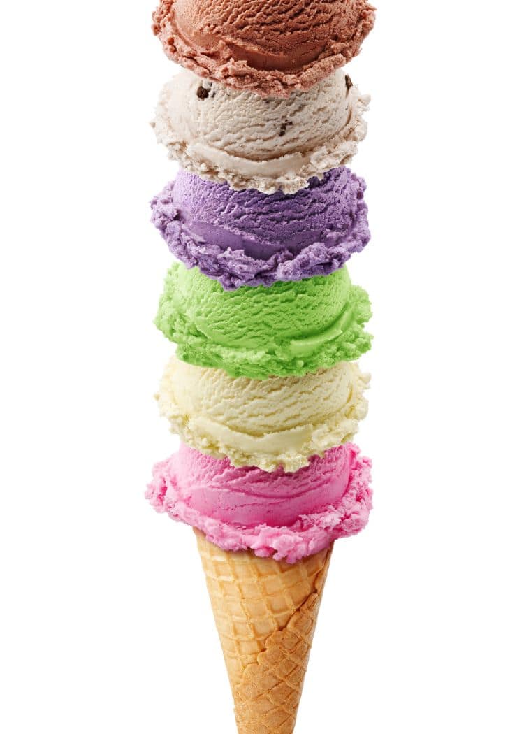 Ice Cream cone stacked high with multiple scoops of ice cream